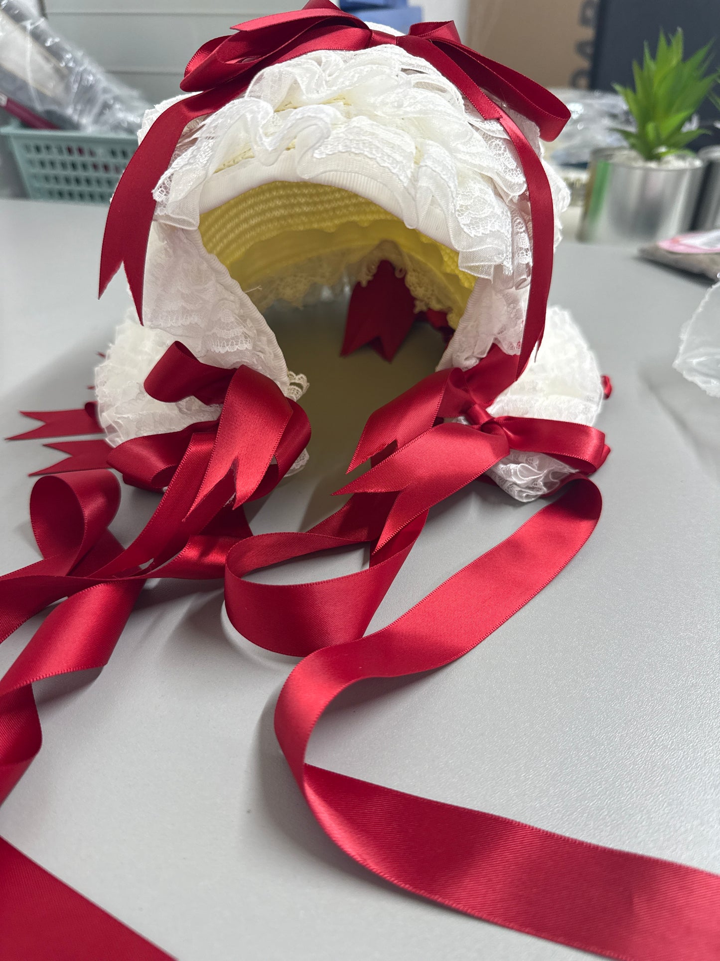 White Bonnet with red satin bows &  ties