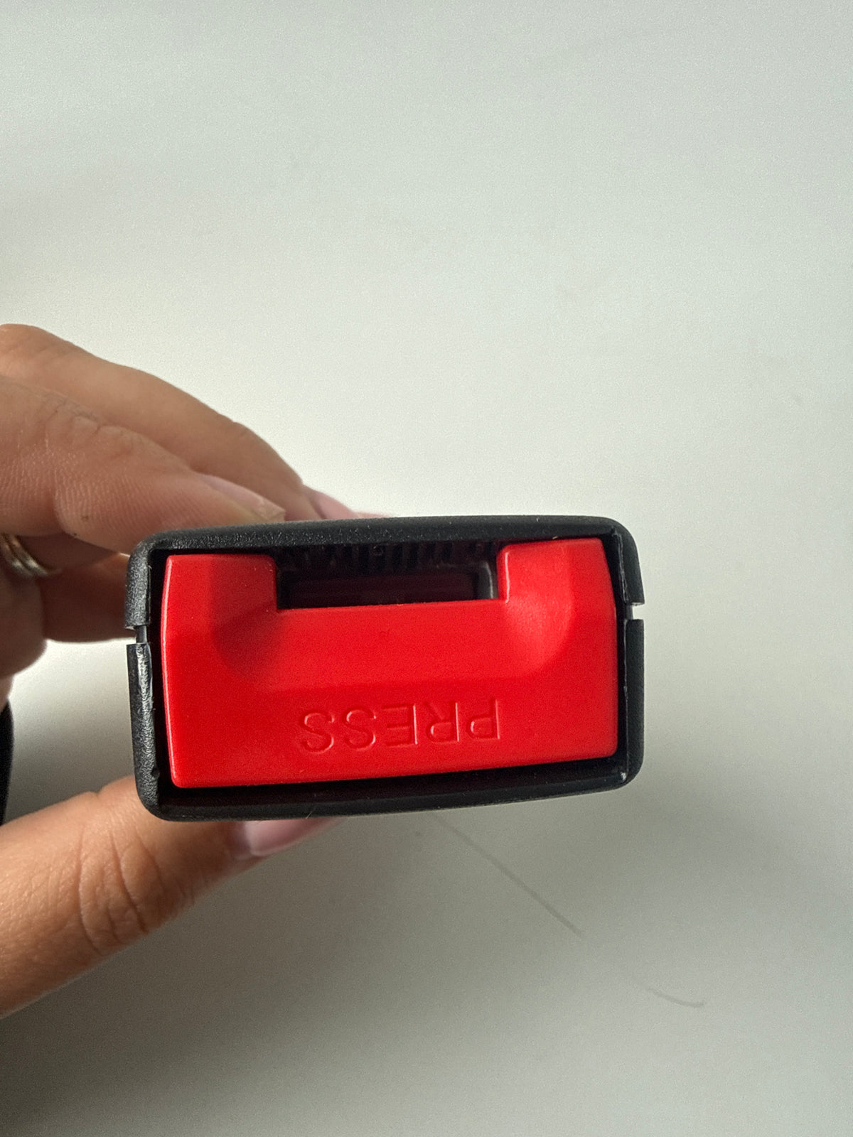 Universal car seat buckle holder